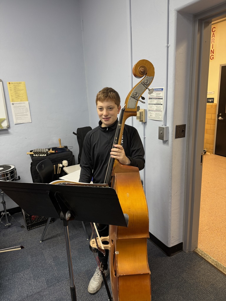 student holding instrument