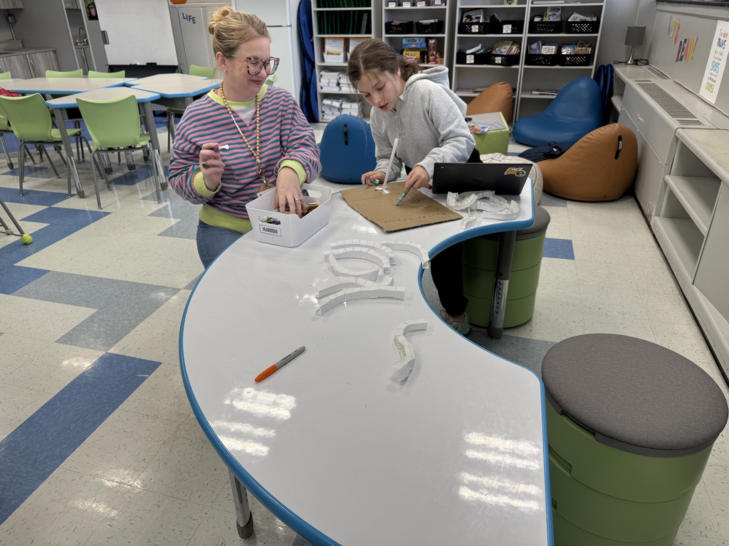 student working with adult