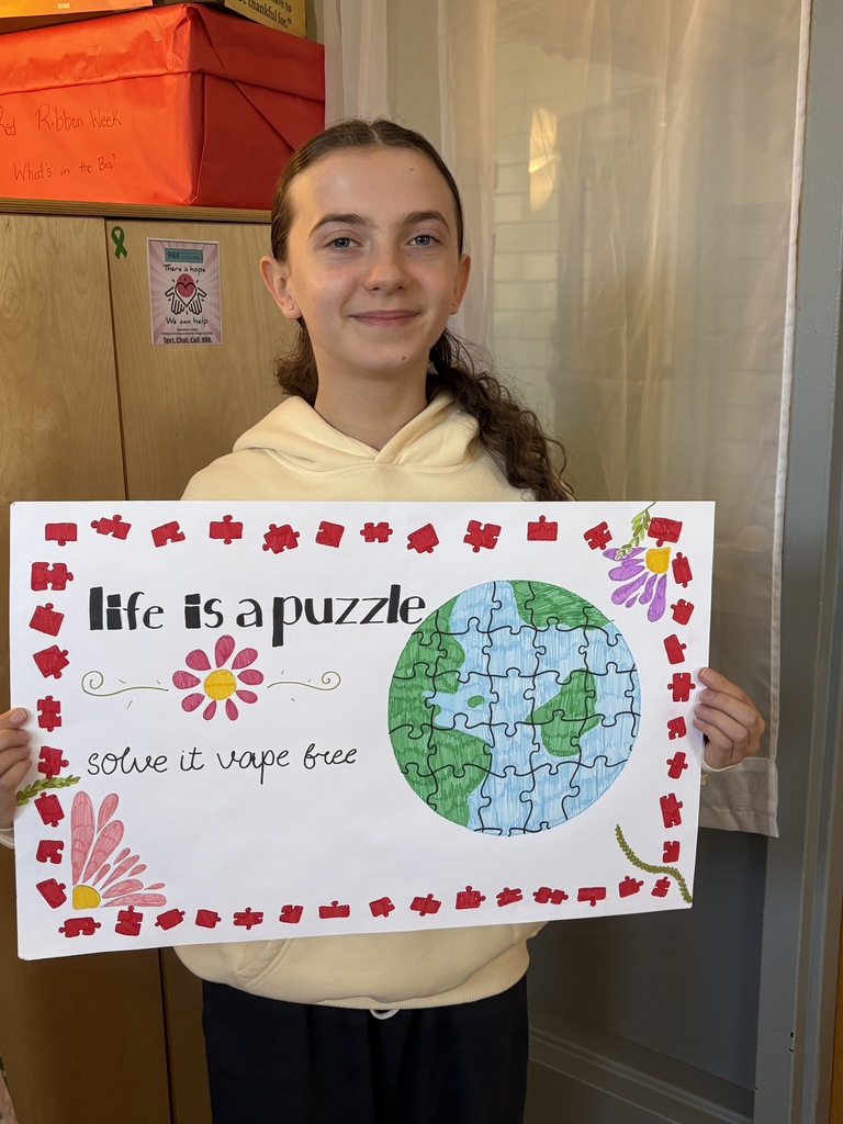 Student holding poster