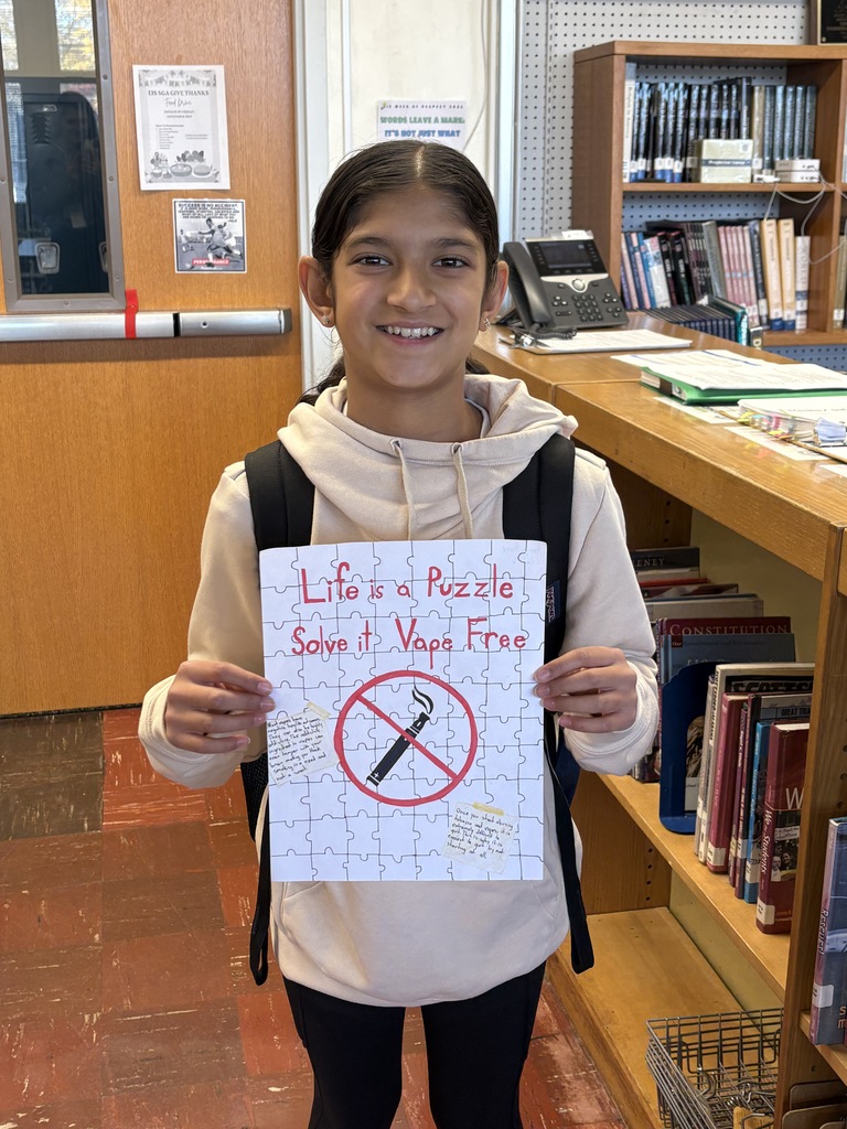 Student holding poster