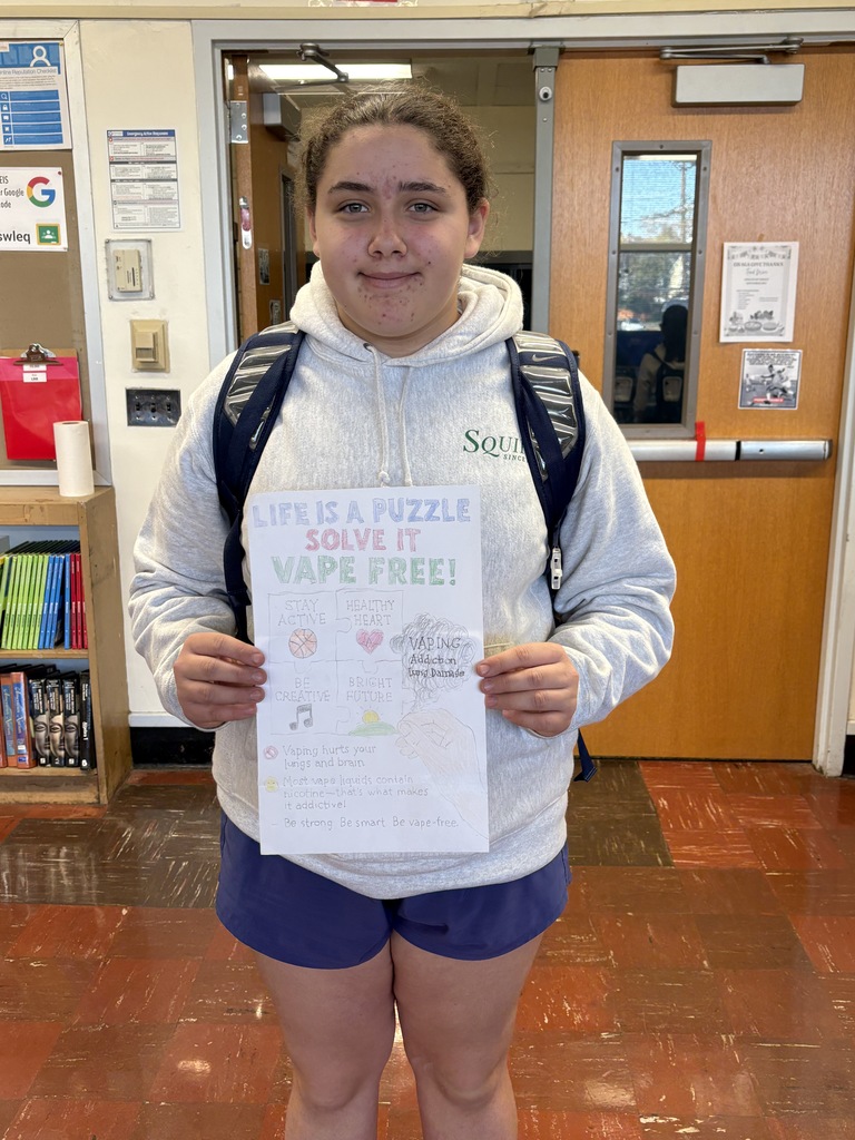 Student holding poster