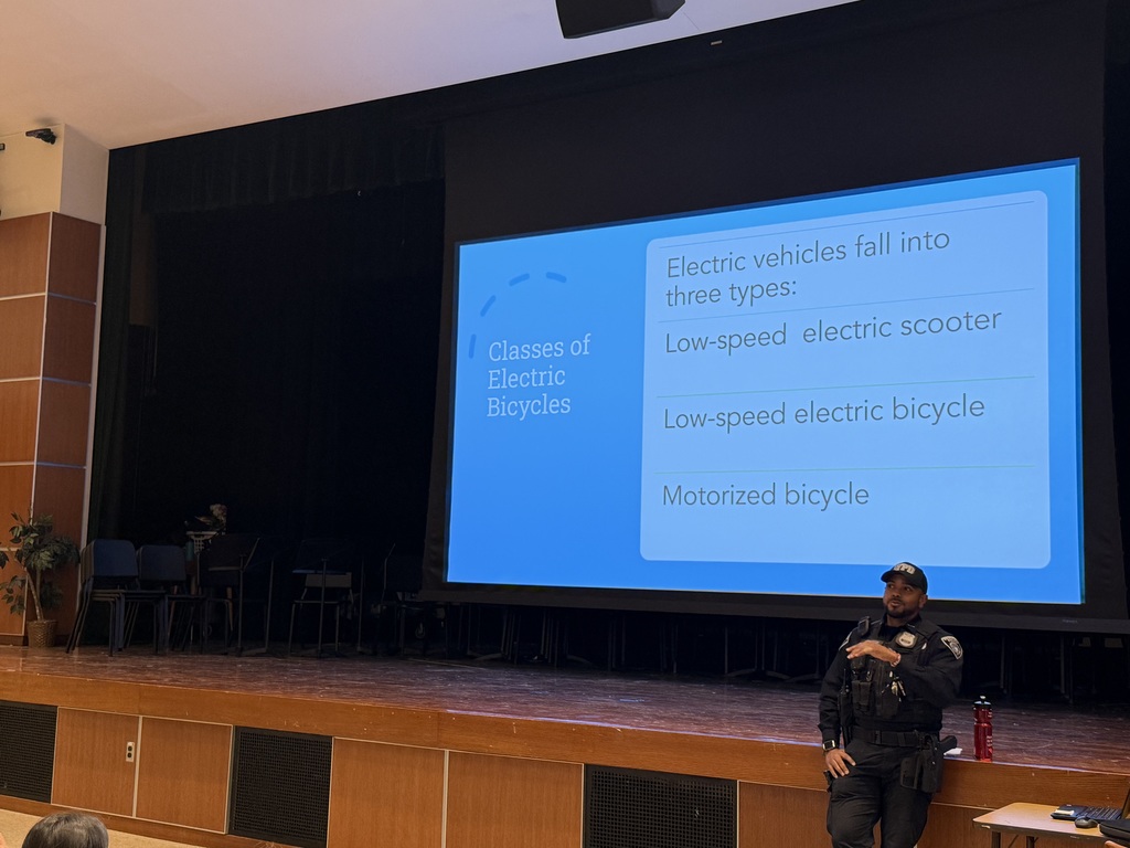 police officer presenting to  students