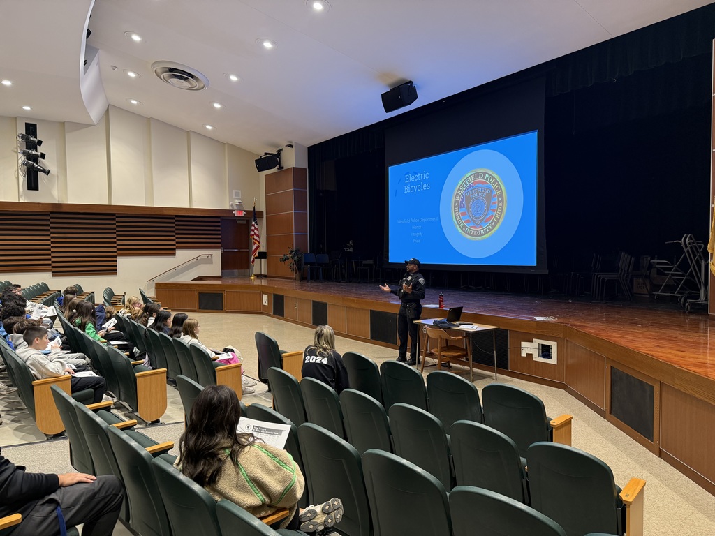 police officer presenting to  students