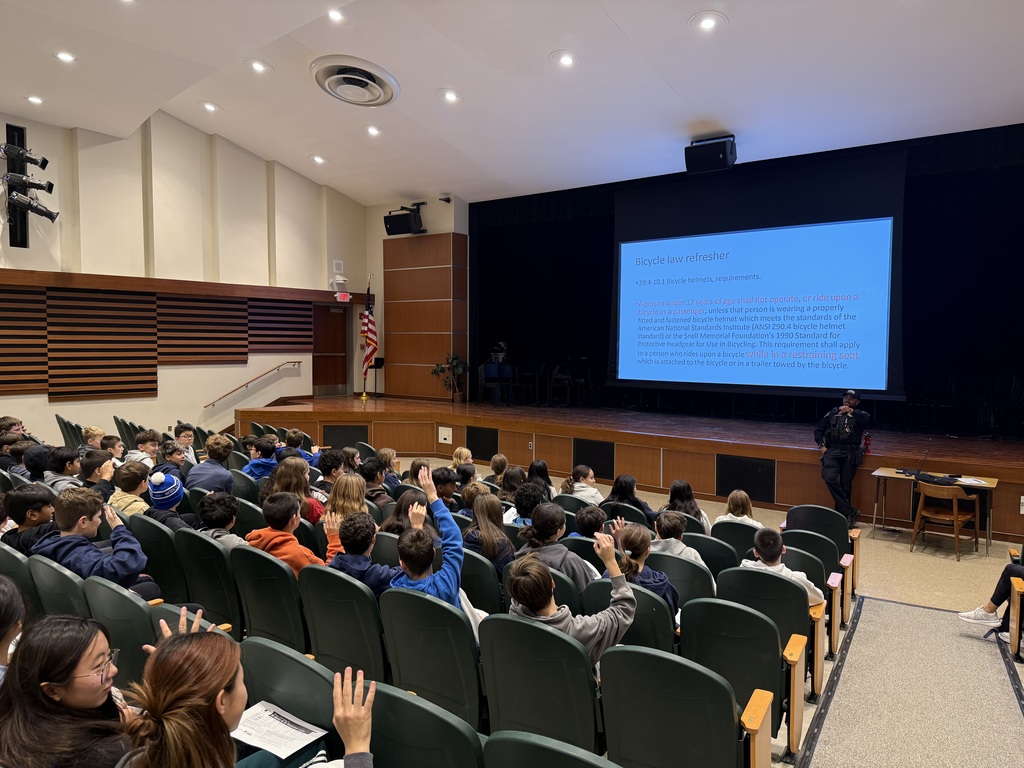police officer presenting to  students