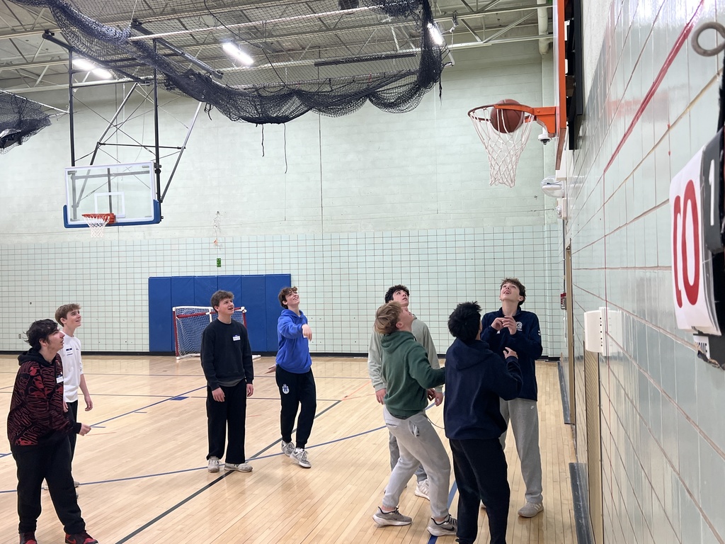 Students play basketball