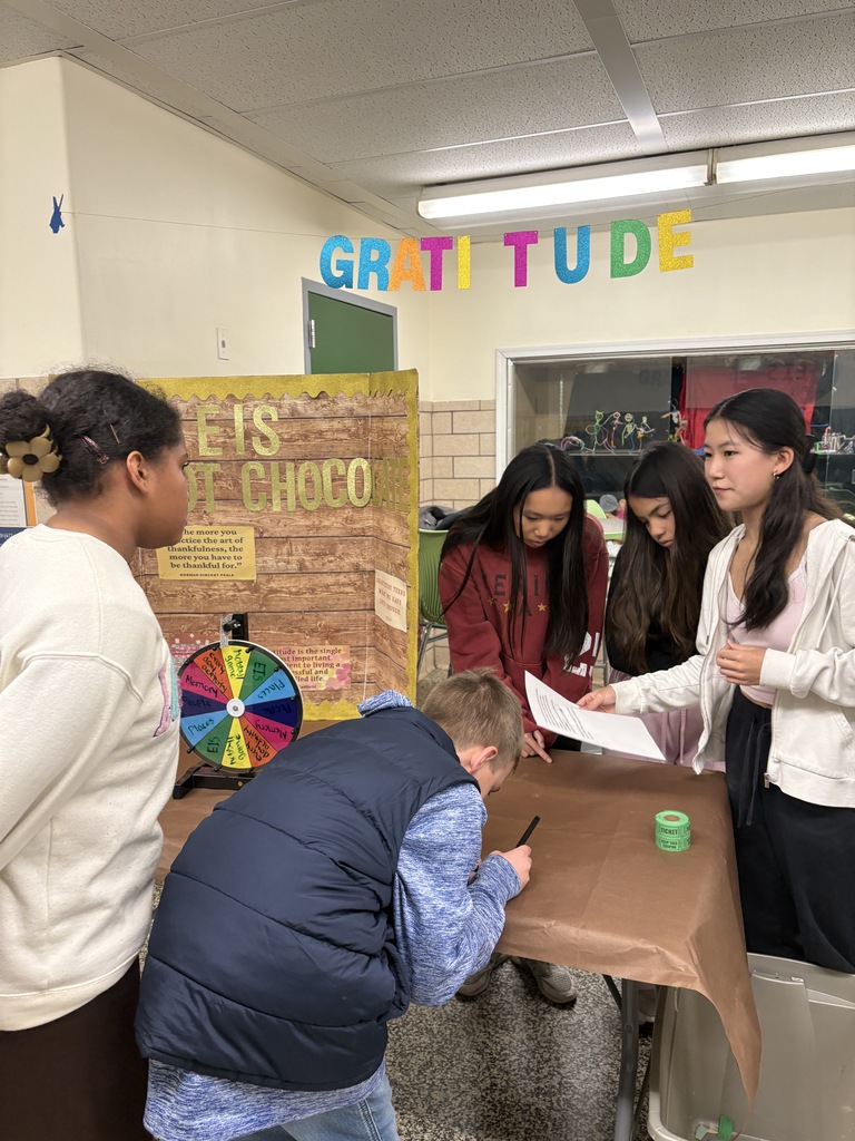 Peer leaders explaining activity to students
