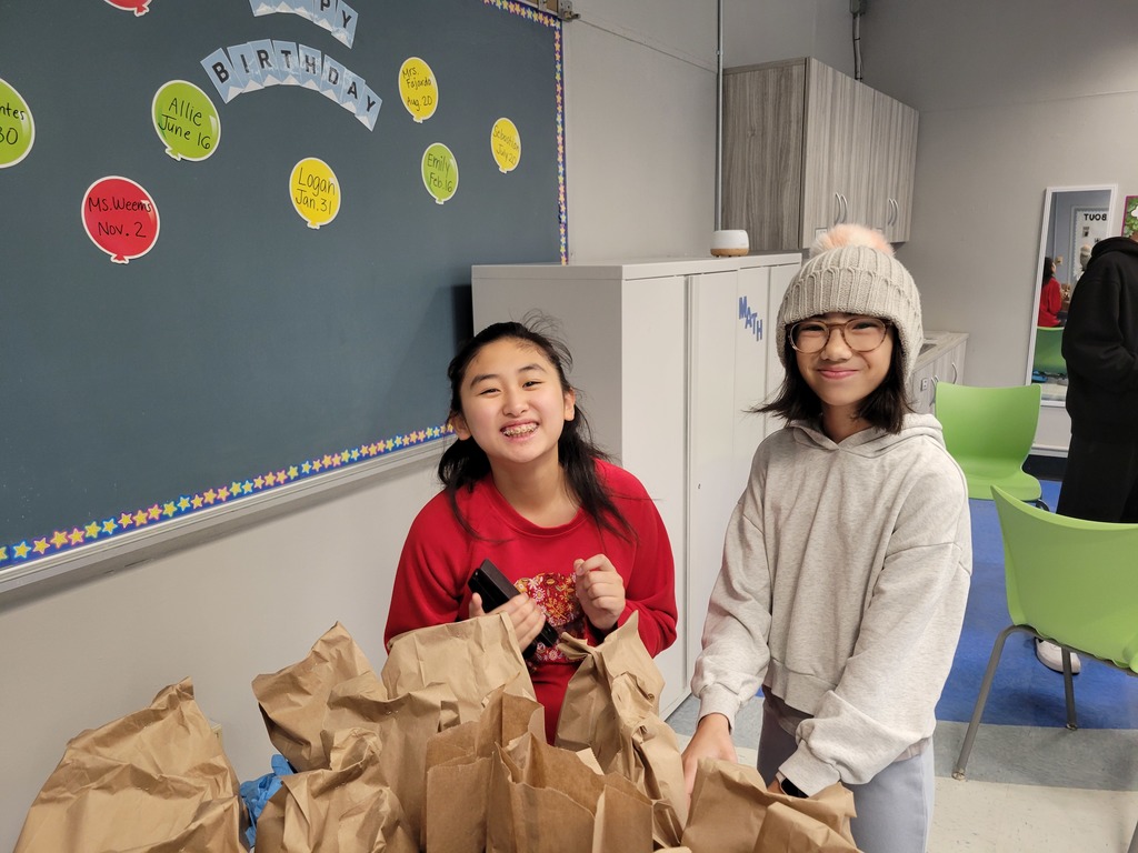 Students standing smiling