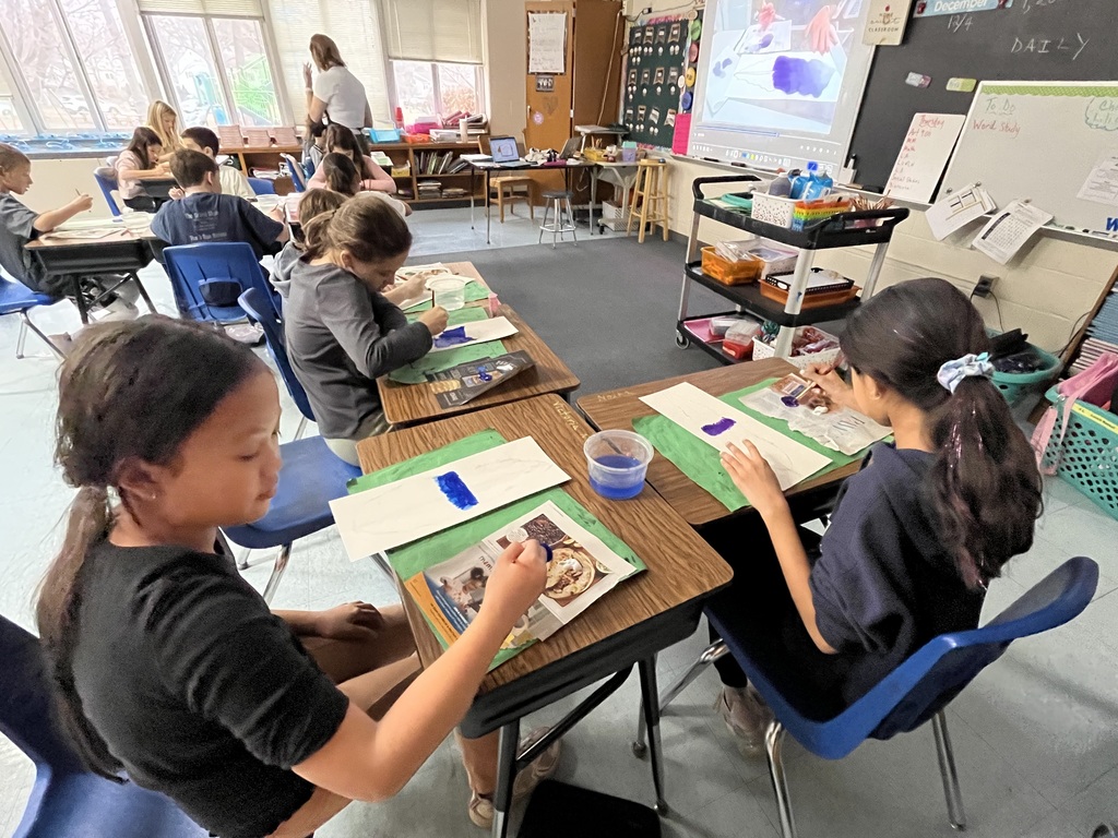 Students painting their feather.