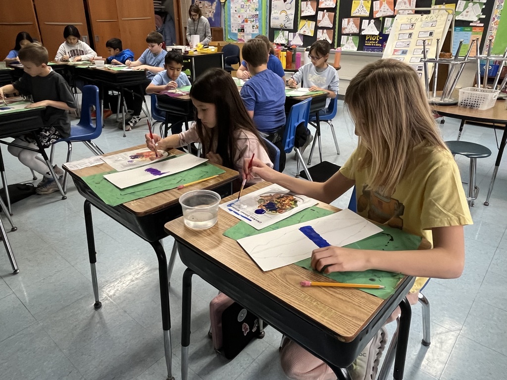 Students painting their feather.