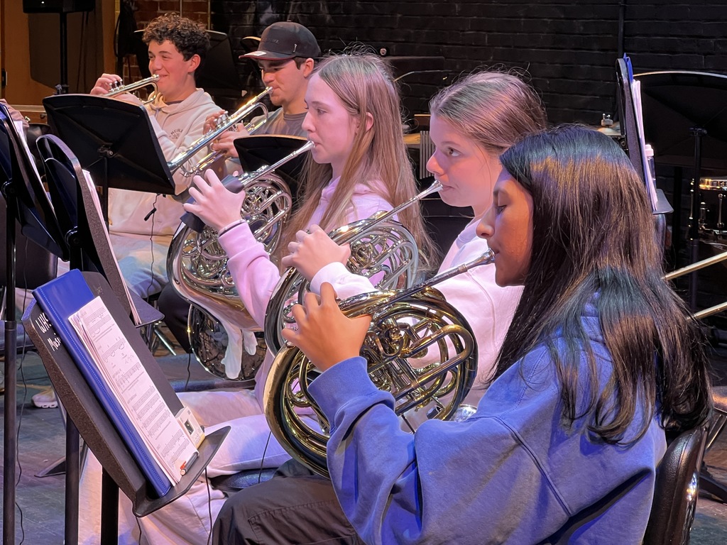Students play the French horn