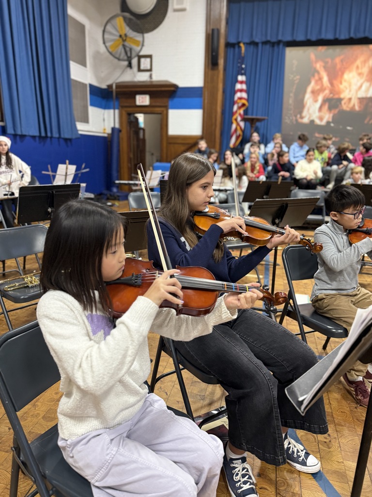 5th grade strings students performing