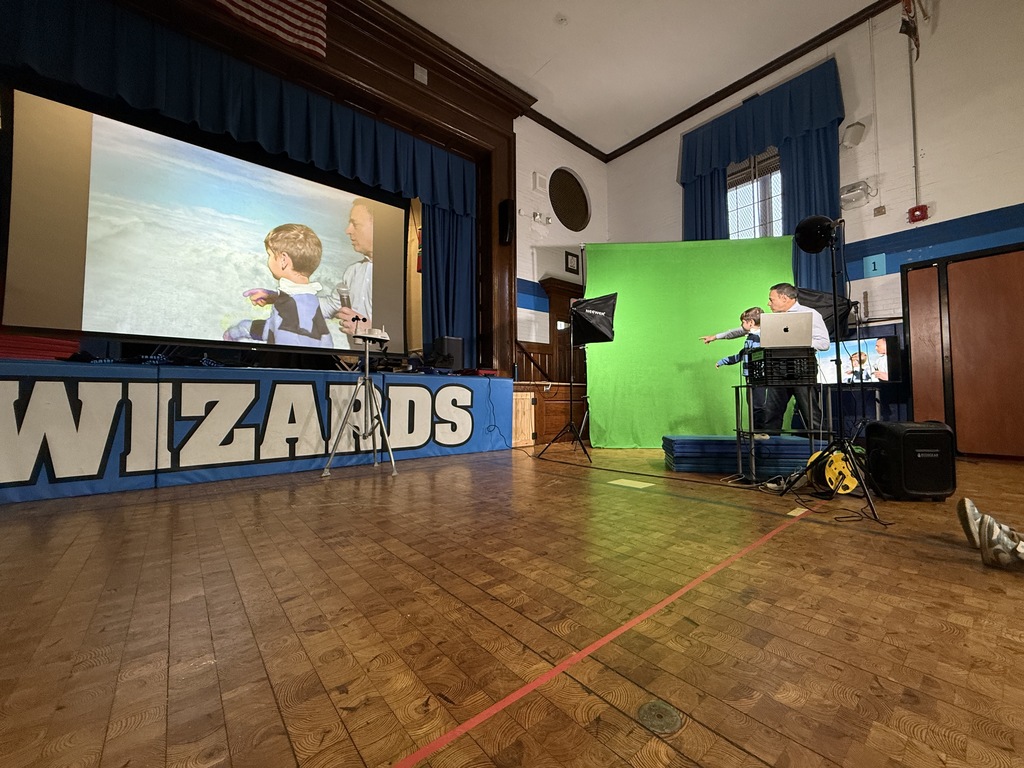 first grade student giving the weather forecast