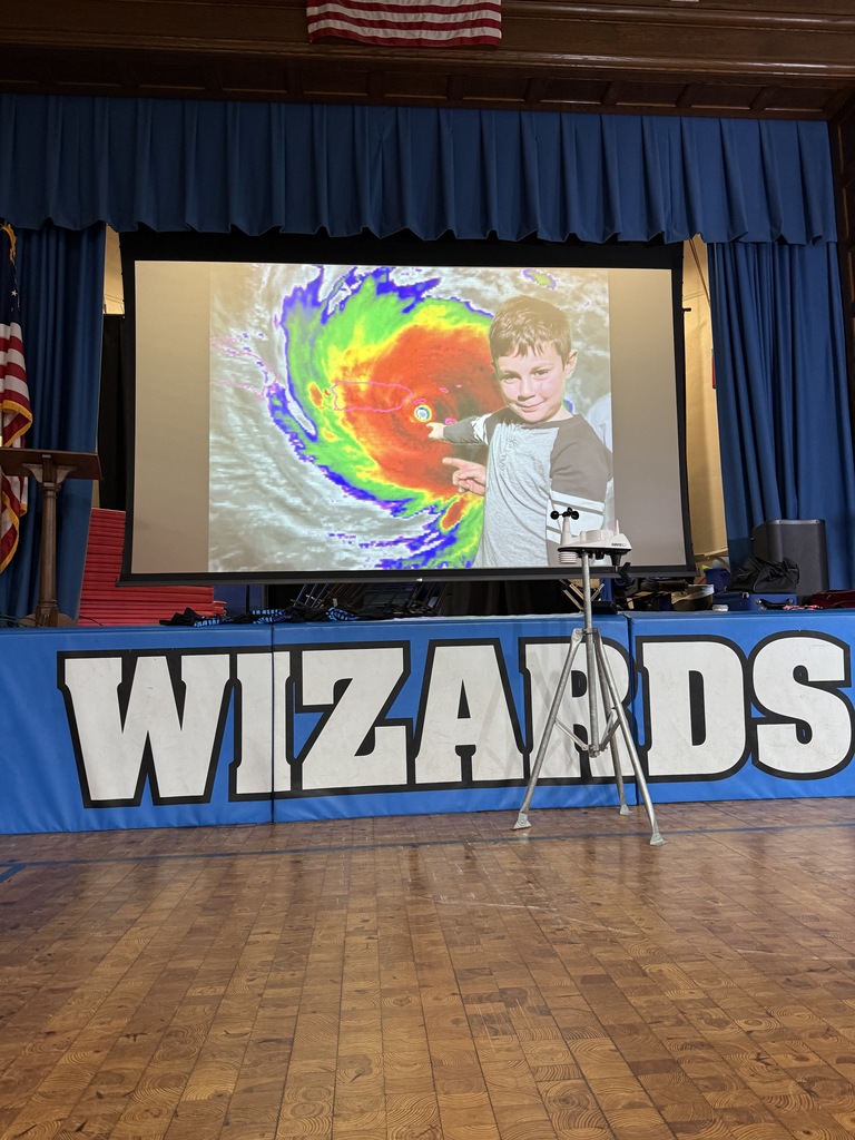 first grade student giving the weather forecast