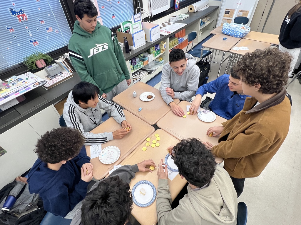 Students playing dreidel 