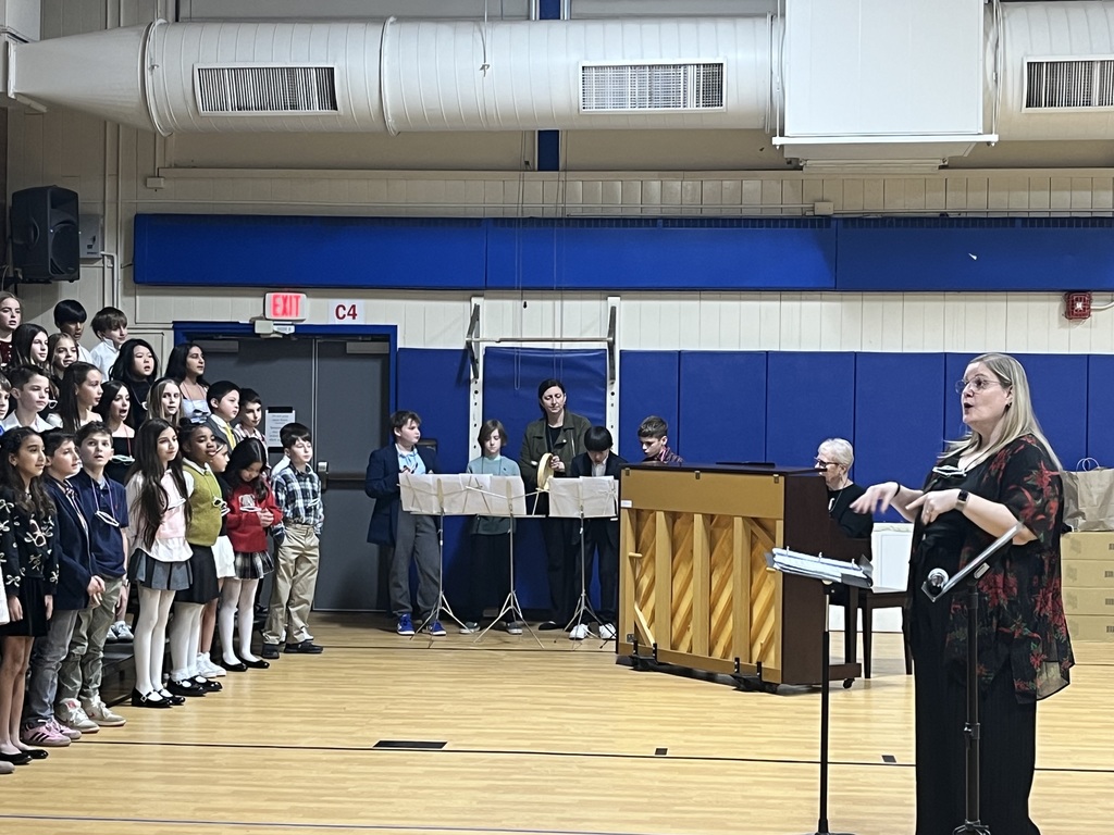 The music teacher conducts the chorus.