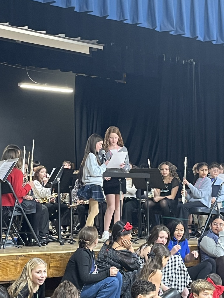 Two students introduce the song.