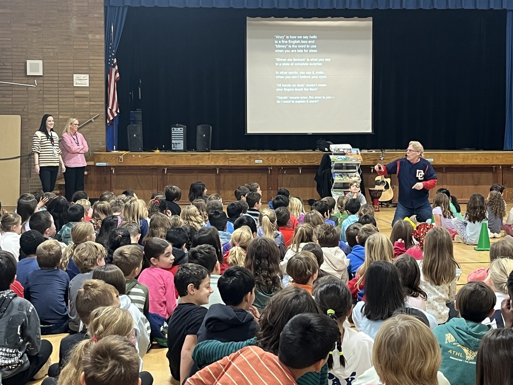 Presenter tells a story with the help of two teachers.