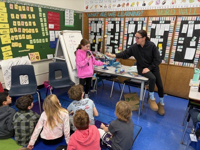Mrs. B and her daughter and sharing the traditions with the class. 