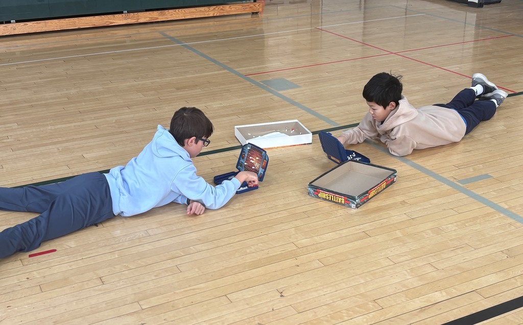 Students playing board games 