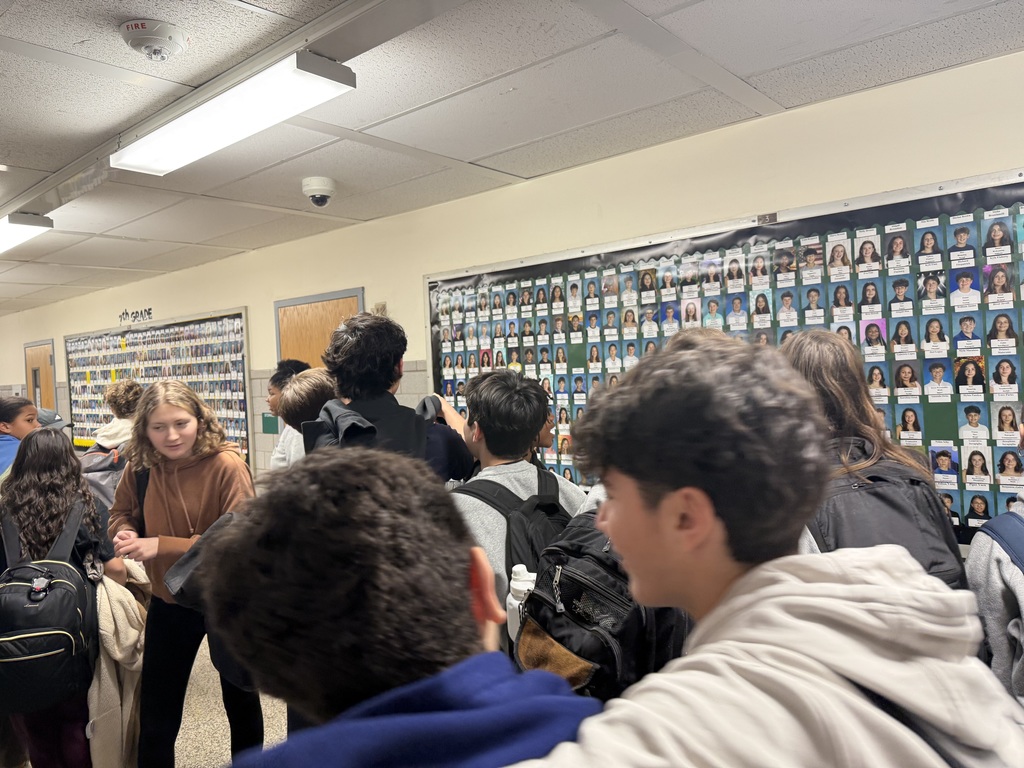 students looking at bulletin board