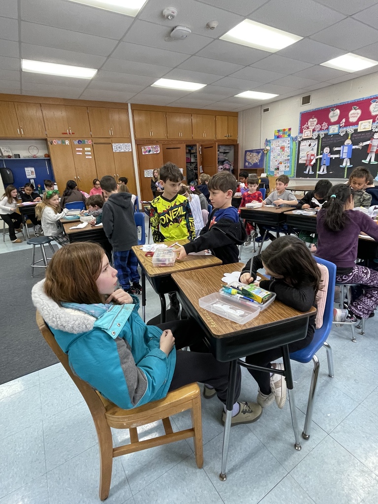 Students writing kind notes to people they love.