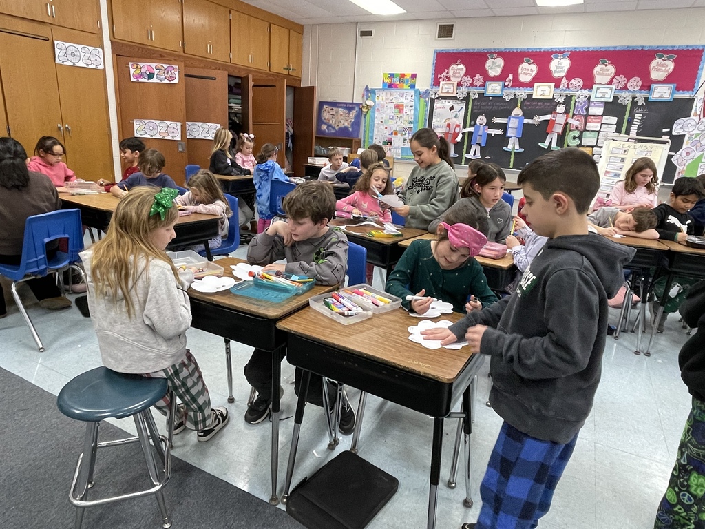Students writing kind notes to people they love.