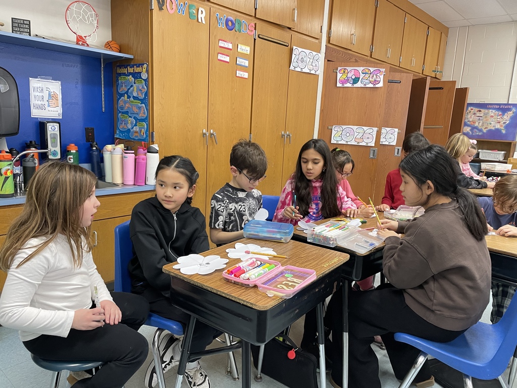 Students writing kind notes to people they love.