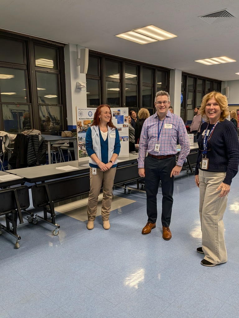 Teachers getting ready to meet incoming freshmen parents.