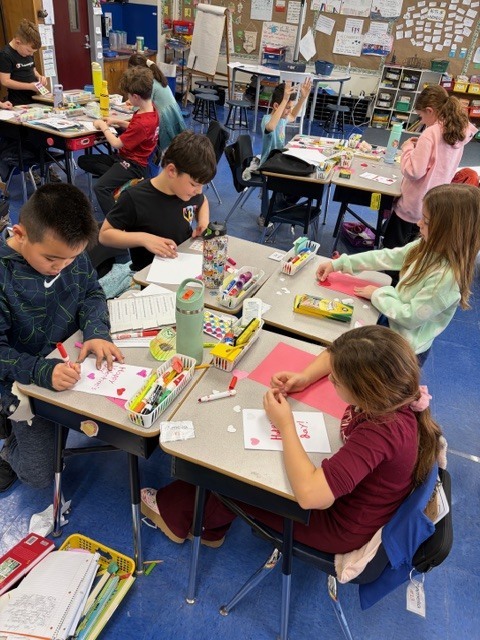 Students making Valentine cards. 