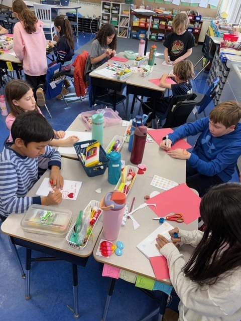 Students making Valentine cards. 