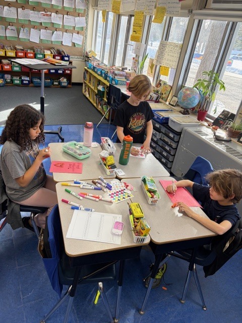 Students making Valentine cards. 