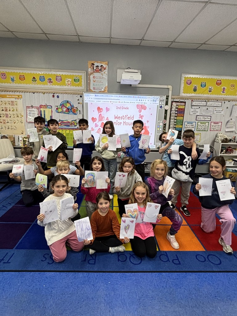 Class 2B proudly show their cards.