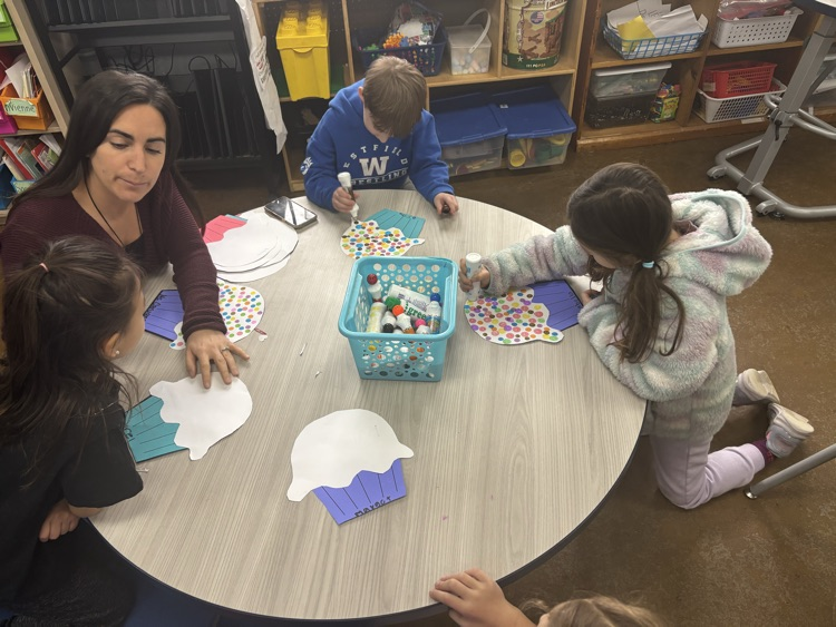 adding 100 sprinkles to cupcakes