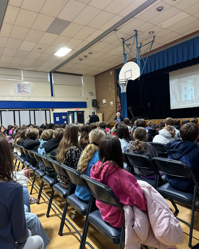 5th grade students listening to speaker