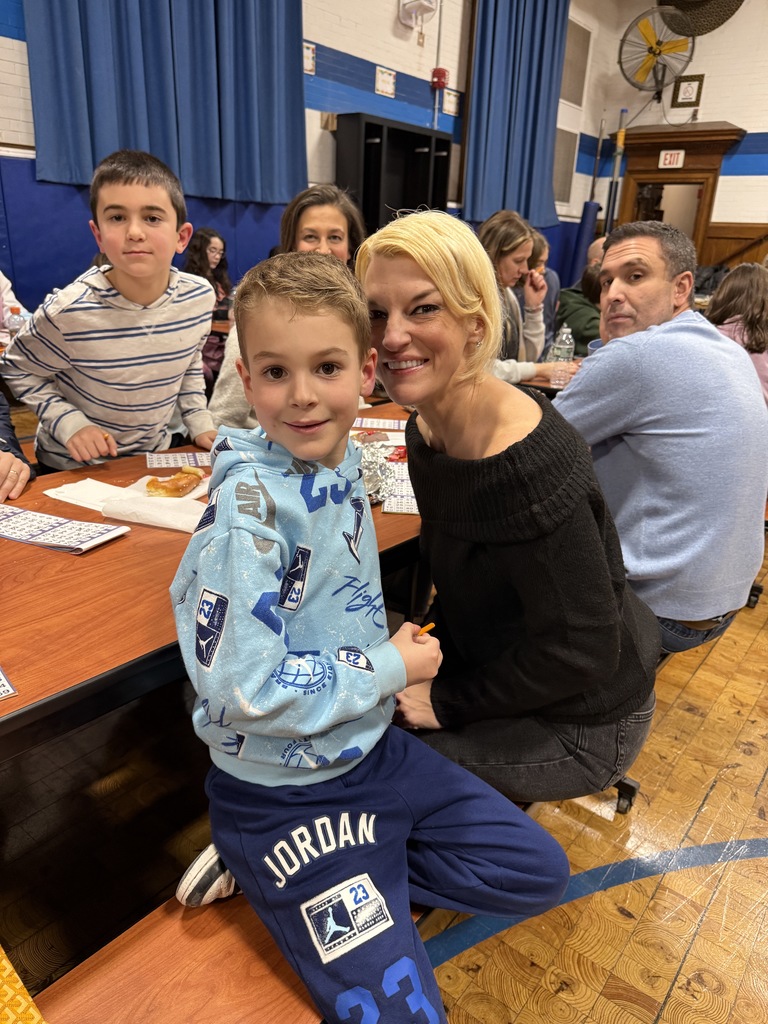family playing BINGO at PTO Family Game Night