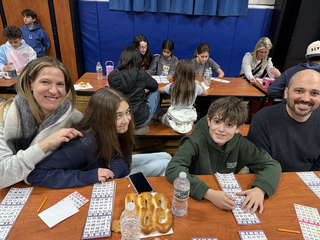 family playing BINGO at PTO Family Game Night