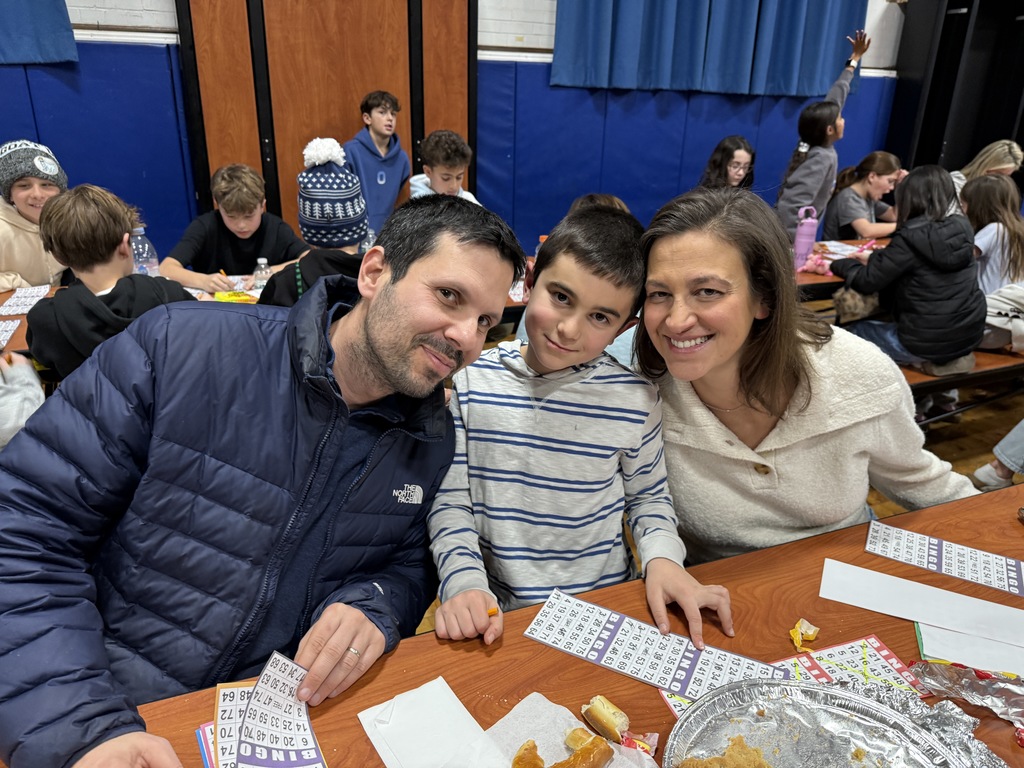 family playing BINGO at PTO Family Game Night