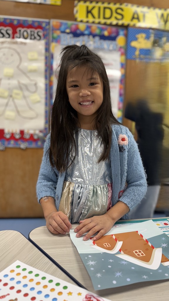 student working on gingerbread craft