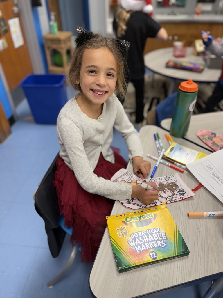 student working on gingerbread craft