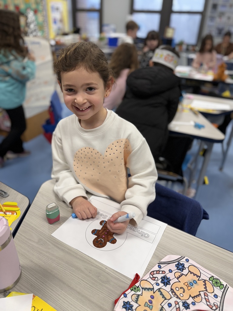 student working on gingerbread craft