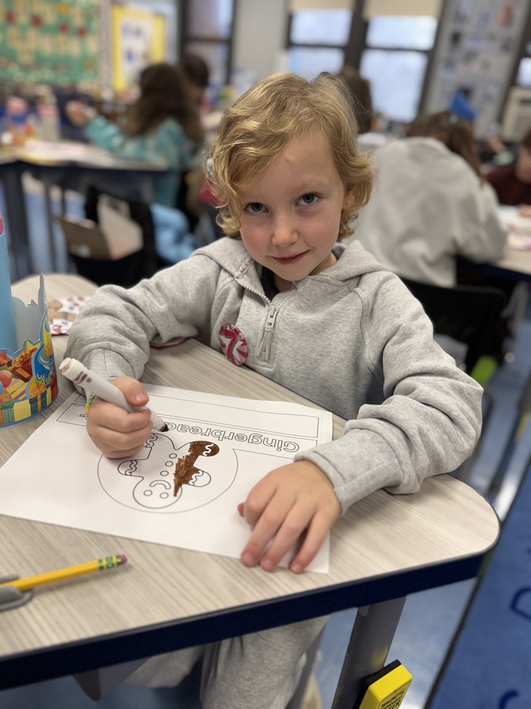 student working on gingerbread craft