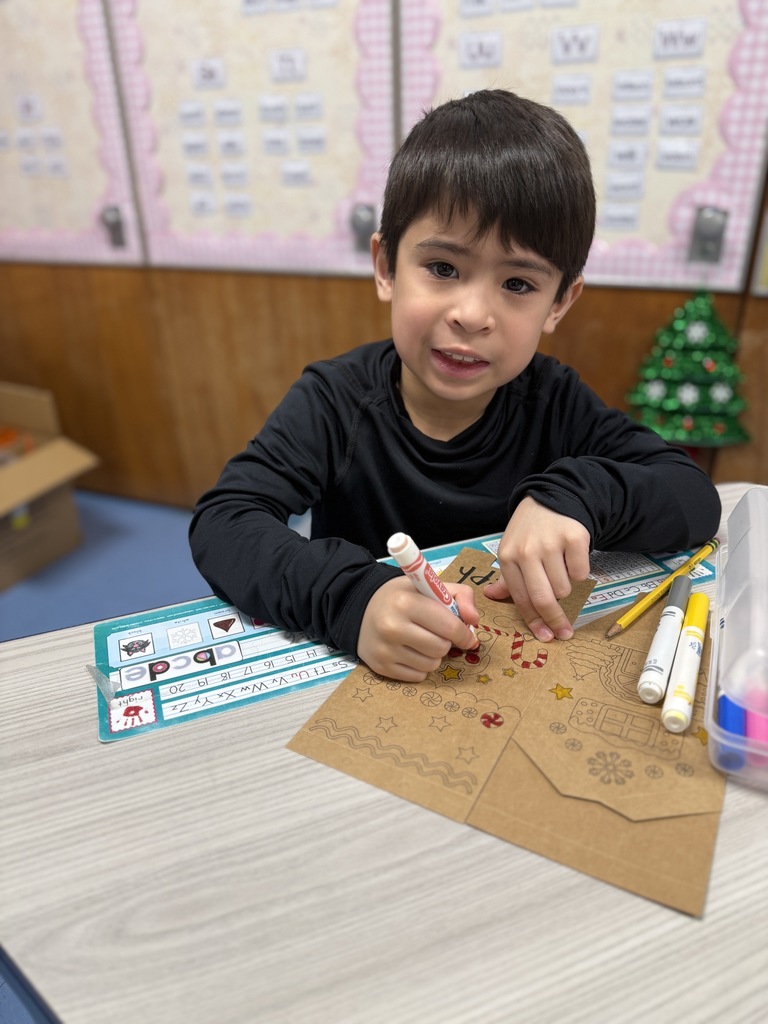 student working on gingerbread craft