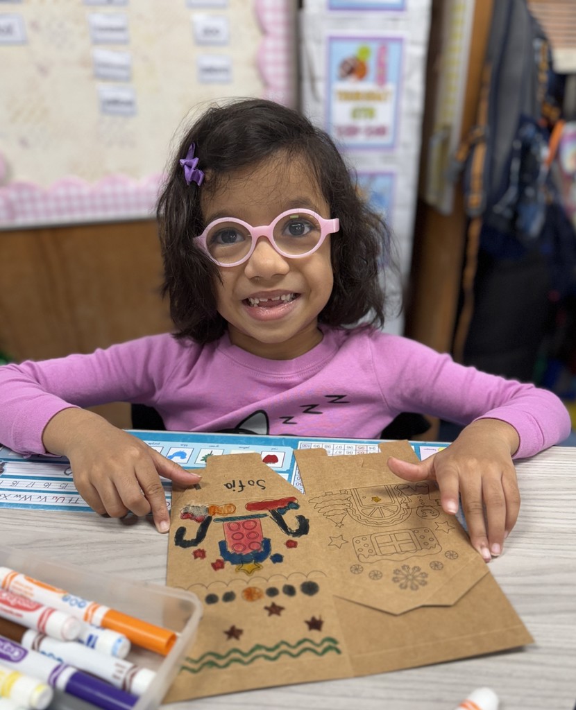 student working on gingerbread craft