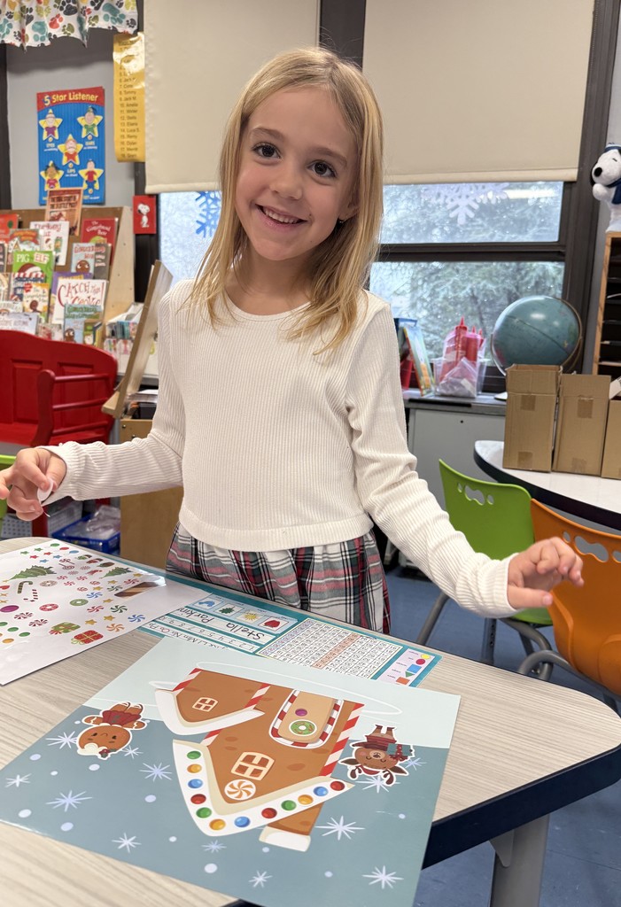 student working on gingerbread craft