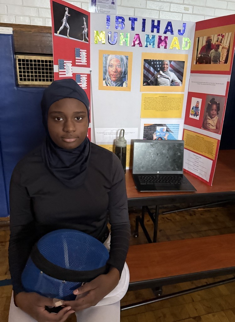 5th grade student in front of their board during the Wax Museum presentations