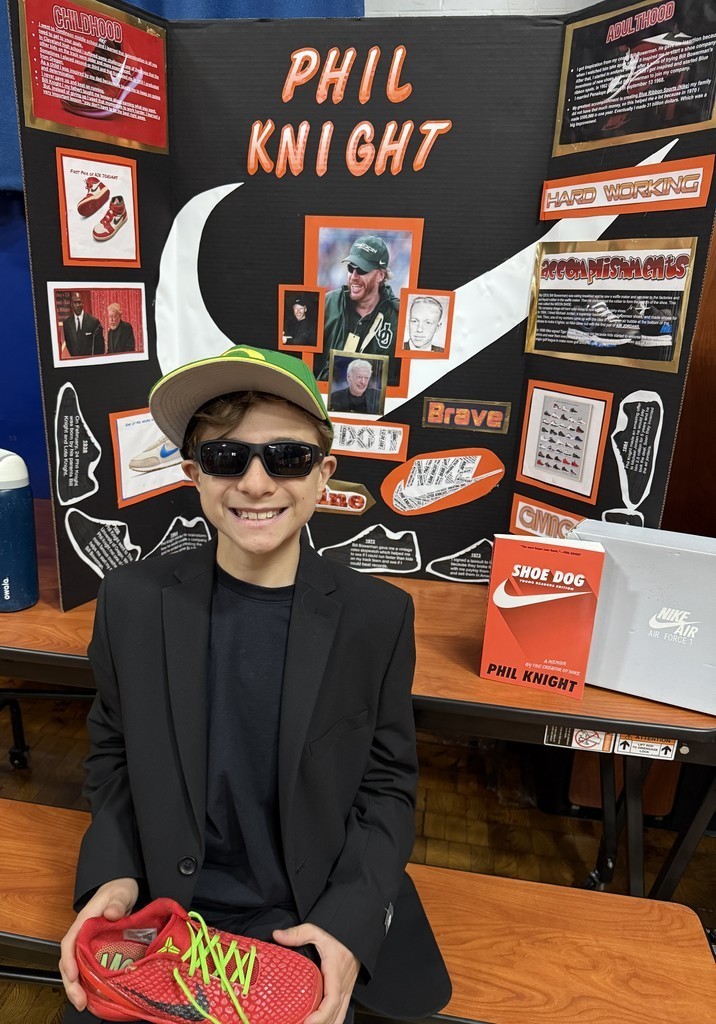 5th grade student in front of their board during the Wax Museum presentations