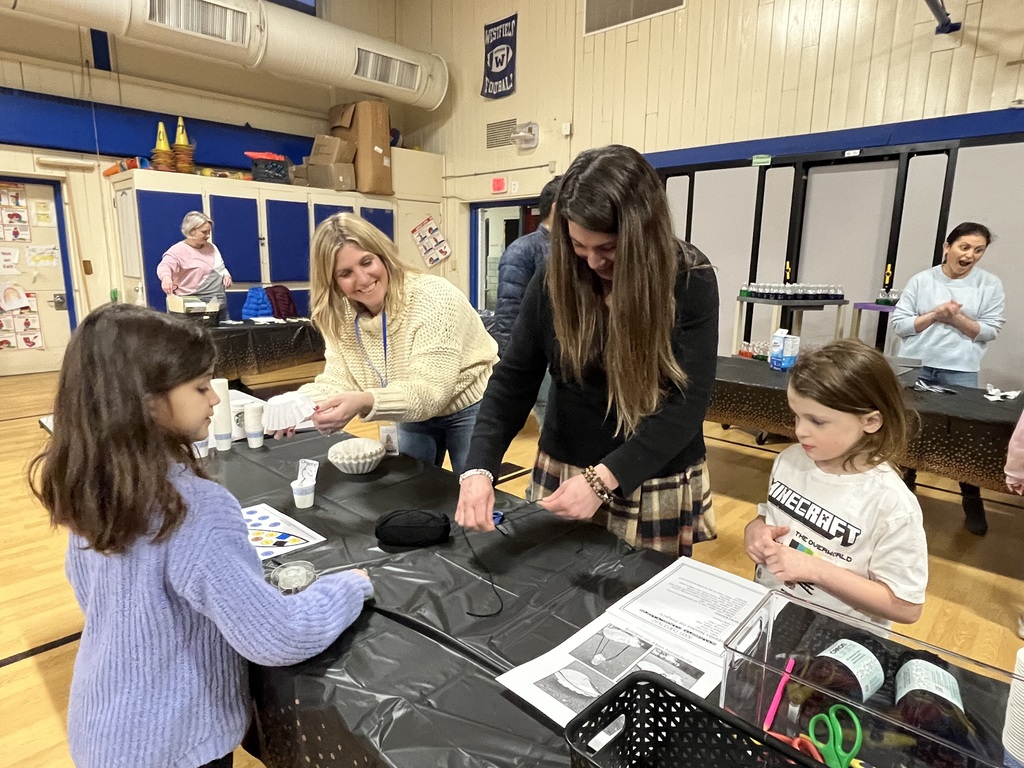 Volunteers at the stations helping students