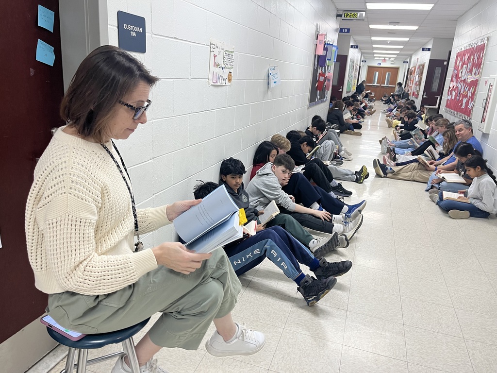 Students and teachers engrossed in reading.