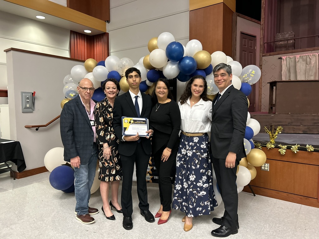WHS Unsung Hero Award Recipient with Principal, organization reps and his parents