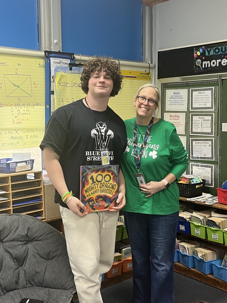 WHS student is photographed with his 3rd grade teacher.